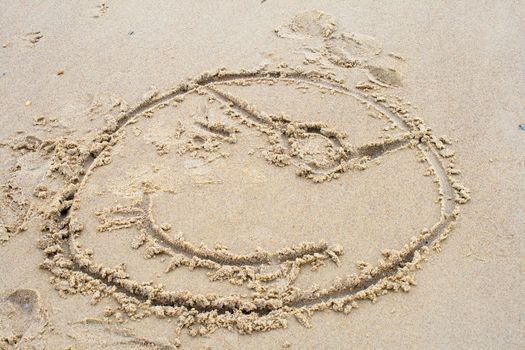 drawing a pirate in the sand on beach