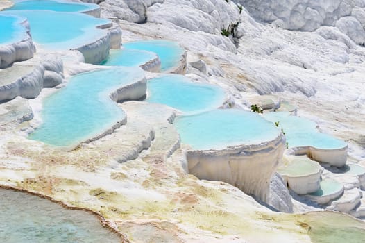 Blue water travertine pools and terraces in Pamukkale, Turkey