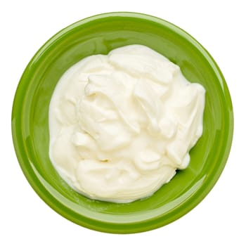 live organic Greek yogurt in an isolated  green ceramic bowl