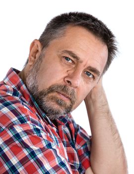 Casual middle aged man with hand near the face with a concerned look