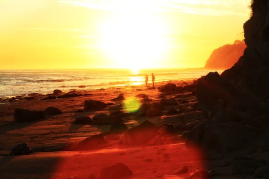 Watching romantic sunset at the beach.