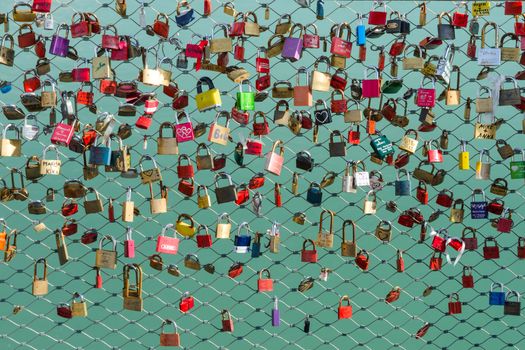 A lot of padlocks on the bridge, which the lovers hanging as a symbol of strong eternal love and loyalty