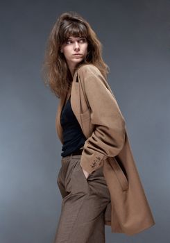 Portrait of a Young Woman in Brown Coat