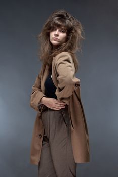 Portrait of a Young Woman in Brown Coat