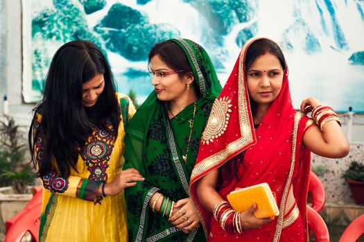 Happy Indian womens in Indian traditional dresses called colourful sarees and suit