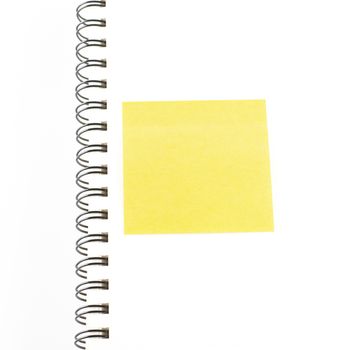 orange sticker note on notebook on a white background
