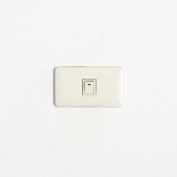 electric white switch on wall