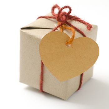 heart tag with single craft cardboard gift box on a white background