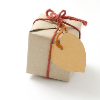 heart tag with single craft cardboard gift box on a white background