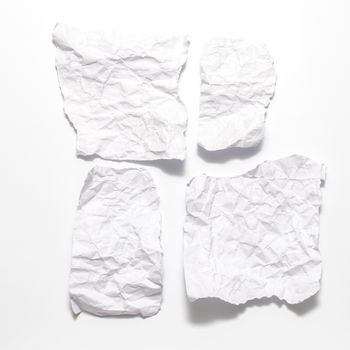 piece of white crumpled paper on a white background