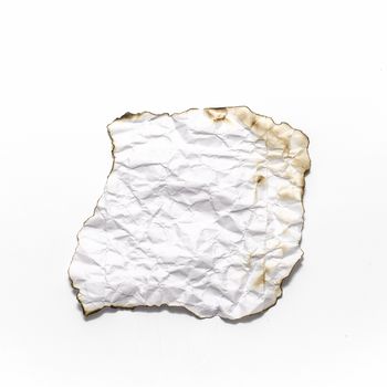 burn of crumpled paper on a white background
