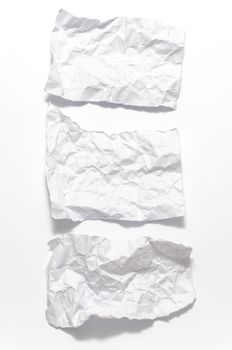 white crumpled paper over white background