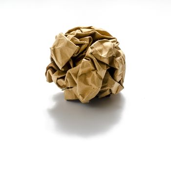 brown coloe crumpled paper ball on a white background