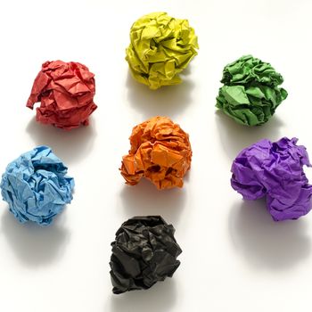 group of color crumpled paper ball on a white background