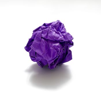 gray color crumpled paper ball on a white background