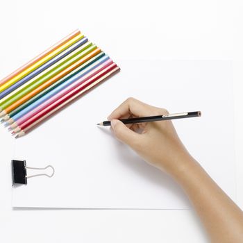 asia woman right hand with black pencil and left hand with colorful pencil on blank white paper over white background