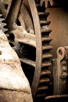 rusting old industrial machine cog wheel background