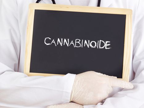 Doctor shows information on blackboard: cannabinoid in german