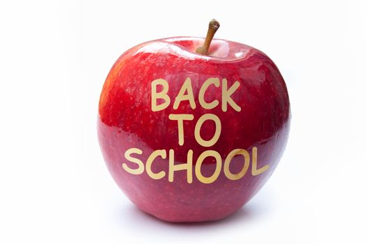 Back to school etched into a red apple 