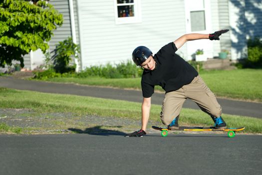 Action shot of a longboarder skating on the street. 