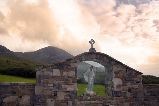 glass holy shrine with croagh patrick mountains in the background