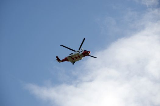 the new Irish coastguard helicopter flying in bright clouds