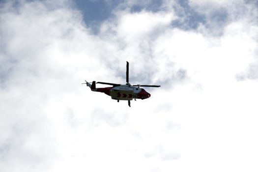 the new Irish coastguard helicopter flying in bright clouds