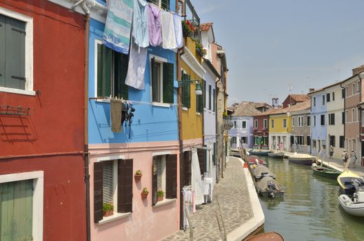 Canal  in Burano, a colorful island of Venice, Italy