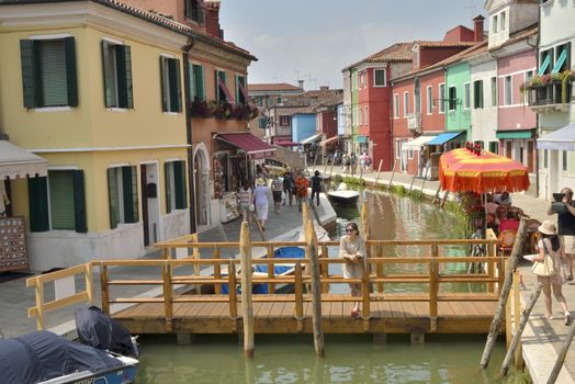 Canal  in Burano, a colorful island of Venice, Italy