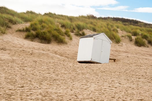 beach cabin overthrown by a storm