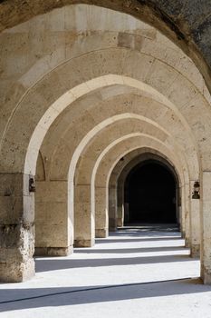 multiple arches and columns in Sultanhani caravansary on Silk Road, Turkey