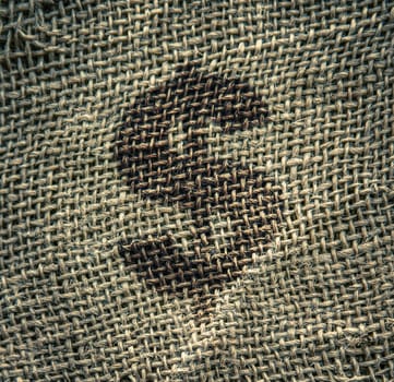A Dollar Symbol On A Rough Burlap Money Sack Or Bag