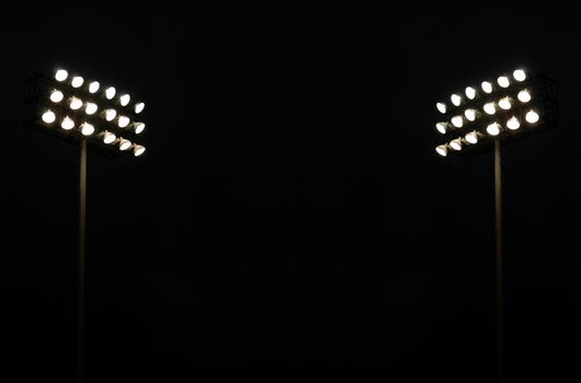 Twin Stadium Lights At A Sports Stadium At Night With Copy Space