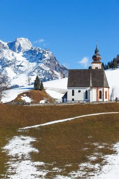 Beautiful winter view of church in Austria. Vertical view