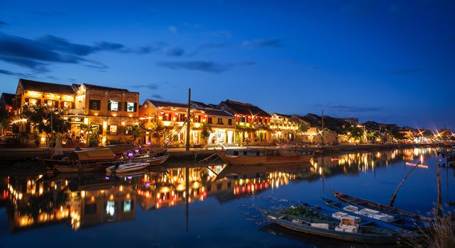 HOIAN TOWN - JUNE 7: Reflection Hoian town into Hoai river by night in June 7 2013, Quangnam province, Vietnam.