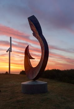 BONDI, AUSTRALIA - OCTOBER 23, 2014; Sculpture by the Sea Annual free public event 2014.  Exhibit titled The Moment by artist Ron Gomboc, WA,  The first glance that bonds mother to child.   Materials, copper Price $55,000