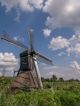 Typical Dutch view of a windmill in the summer in Drenthe