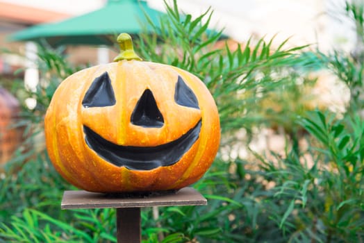 Halloween scary pumpkin with smile at outdoor scene