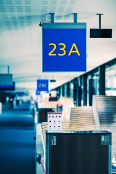 Vertical view of airport gate sign