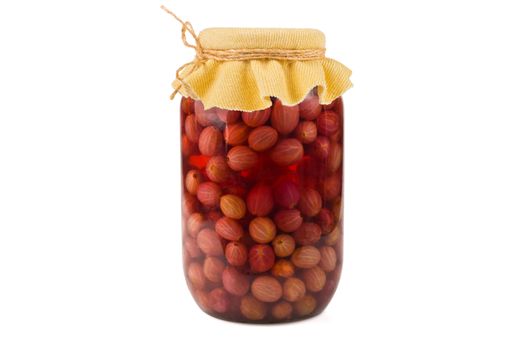 Jar of canned gooseberry compote on a white background