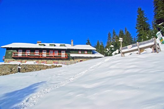 Mountain cabin in winter, Romanian Carpathians.