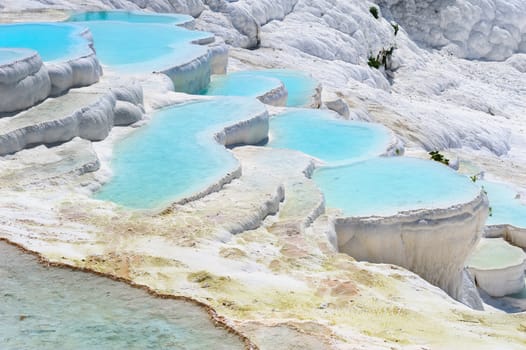 Blue water travertine pools and terraces in Pamukkale, Turkey