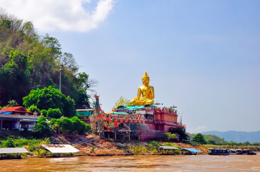 Beautiful Golden Buddha statue, at public temple, Wat Phabuddha navarantur - Golden Triangle in Chiang Rai,Thailand.