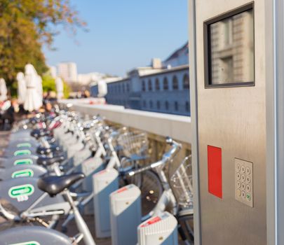 Station of urban bicycles for rent downtown. Green sustainable ecological public transport. Healthy lifestyle.