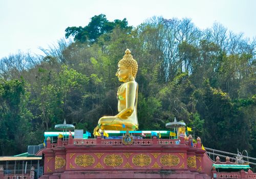 Beautiful Golden Buddha statue, at public temple, Wat Phabuddha navarantur - Golden Triangle in Chiang Rai,Thailand.