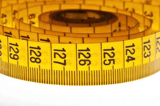 diet - yellow measuring tape isolated on white background