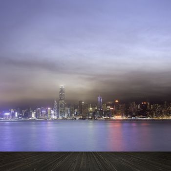 City night scenes of Victoria harbor in Hong Kong with copyspace on heaven.