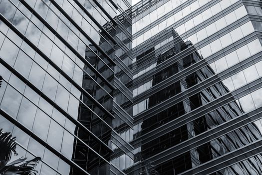 Office glass windows with beautiful reflection in Hong Kong, Asia.