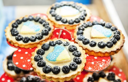 Cookie with berries and heart with ukrainian flag
