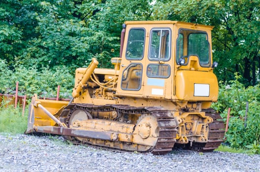 Velbert, Germany - May 29.2014: On an old factory site in the city of Velbert in NRW is this old tracked vehicle, caterpillar bulldozer. The Olttimer, awaiting use.